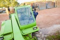 Woman getting in telehandler