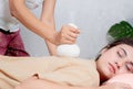 woman getting Thai herbal compress massage in spa Royalty Free Stock Photo