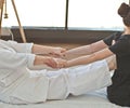 Woman getting traditional yoga massage by therapist