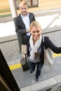 Woman getting on the train man smiling Royalty Free Stock Photo