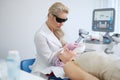 Woman getting treatment with aesthetic dermatology device Royalty Free Stock Photo