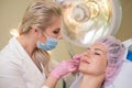 Woman getting treatment with injectable hyaluronic acid dermal filler