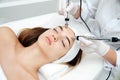 Woman getting ultrasound face beauty treatment in medical spa center Royalty Free Stock Photo