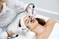 Woman getting ultrasound face beauty treatment in medical spa center Royalty Free Stock Photo