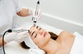 Woman getting ultrasound face beauty treatment in medical spa center Royalty Free Stock Photo