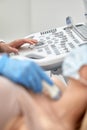 woman getting ultrasound of a thyroid from doctor Royalty Free Stock Photo