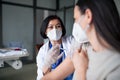 Woman getting vaccinated in hospital, coronavirus and vaccination concept.