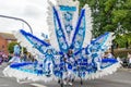 Woman in giant blue and white costume in Leeds West Indian Carnival Parade