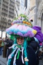 Woman in giant Easter egg hat and blue wig in the Easter Bonnet Parade