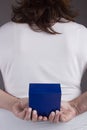 Woman with a gift behind her back Royalty Free Stock Photo