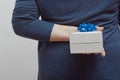 Woman with a gift behind her back Royalty Free Stock Photo