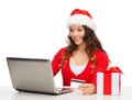 Woman with gift, laptop computer and credit card Royalty Free Stock Photo