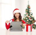 Woman with gift, laptop computer and credit card Royalty Free Stock Photo