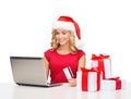 Woman with gifts, laptop computer and credit card Royalty Free Stock Photo