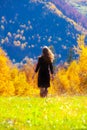 Woman girl autumn forest ray sunlight red yellow deep sun Royalty Free Stock Photo