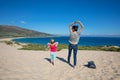 Woman and girl doing gymnastics on top of the Valdevaqueros dune