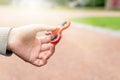 Woman or girl holding red fidget spinner in hand Royalty Free Stock Photo