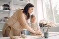 Portrait of mother and little girl shaping clay together Royalty Free Stock Photo