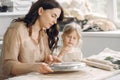 Portrait of mother and little girl shaping clay together Royalty Free Stock Photo