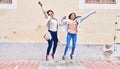 Woman and girl mother and daughter jumping at street Royalty Free Stock Photo