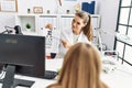 Woman and girl oculist and patient examining vision using snellen test at clinic Royalty Free Stock Photo