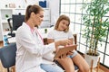 Woman and girl pediatrician and patient having medical consultation at clinic Royalty Free Stock Photo