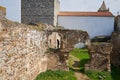 Woman girl traveler in Mourao castle towers and wall historic building in Alentejo, Portugal