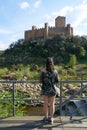 Woman girl traveler seeing Almourol castle in Portugal