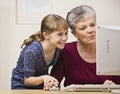 Woman and Girl Using Computer