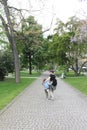 Woman and girl walk in the garden