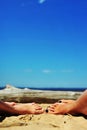 Woman and girls feet in the sand on the beach Royalty Free Stock Photo