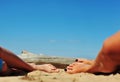 Woman and girls feet in the sand on the beach Royalty Free Stock Photo