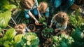A woman and girls are planting plants in a garden AIG41 Royalty Free Stock Photo