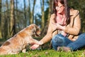 Woman gives dog a treat and gets the paw Royalty Free Stock Photo