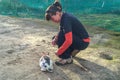 Woman gives food to rabbit. Nature love and vegan concept