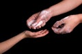 A woman gives her child a soap to protect against Coronavirus