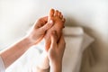 a woman gives a massage to a little girl, children's massage, prevention of scoliosis, osteopathy, copy space Royalty Free Stock Photo