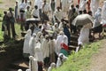 A woman gives some food to parishioners at the end of a religious ceremony in Lalibela. Ethiopia. Royalty Free Stock Photo