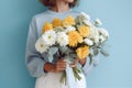 woman sweater blue floral hand gift white flower yellow bouquet romantic. Generative AI. Royalty Free Stock Photo
