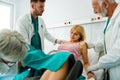 Woman giving birth in hospital with medical doctor team Royalty Free Stock Photo