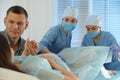 Woman giving child birth in maternity hospital, focus on midwives Royalty Free Stock Photo