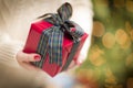 Woman Giving a Christmas Gift Royalty Free Stock Photo