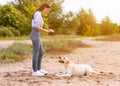 Woman giving a command to her obedient labrador Royalty Free Stock Photo