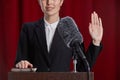 Woman Giving Oath on Stage Royalty Free Stock Photo