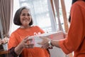 Woman giving present to her elderly mother Royalty Free Stock Photo