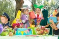 Woman giving presents to children