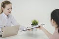 Woman giving resume document to office in job interview Royalty Free Stock Photo