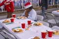 A woman giving thanks for her Christmas dinner