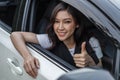 Woman giving thumb up inside her car Royalty Free Stock Photo