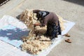 Woman giving wool an airing